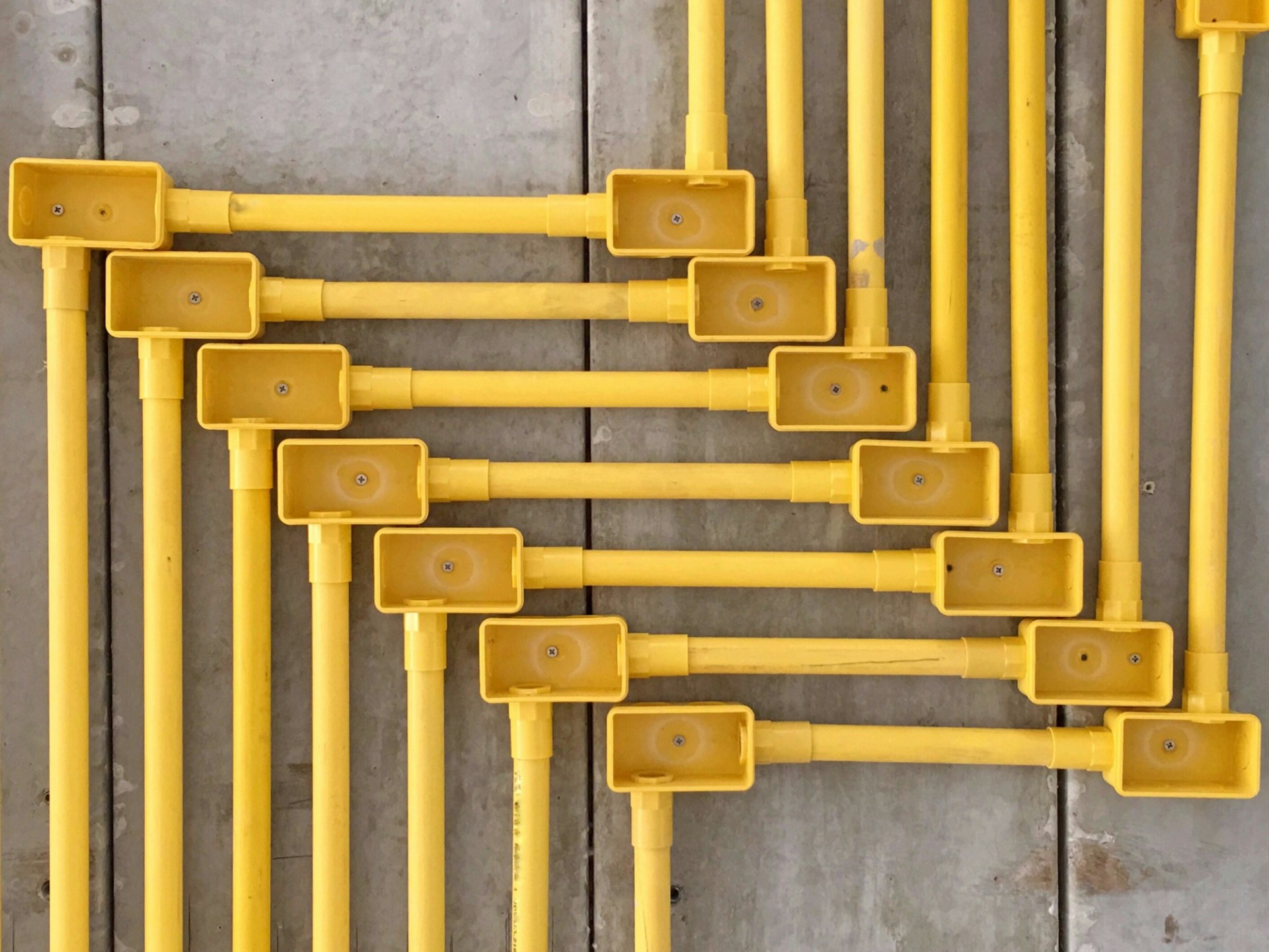 Perspective pvc pipelines on the cement ceiling under installation in the house under construction